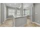 Spacious main bathroom features double sinks, natural light, and custom tile flooring at 213 Lewiston Ct, Cary, NC 27513