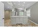 Spacious main bathroom featuring double sinks, natural light, stand alone shower, and custom tile flooring at 213 Lewiston Ct, Cary, NC 27513