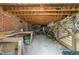 Spacious crawlspace with workbench, storage, and outside access at 213 Lewiston Ct, Cary, NC 27513