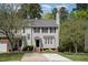 Charming two-story townhouse with neutral siding, black shutters, and a well-manicured front lawn at 22 Lure Ct, Durham, NC 27713