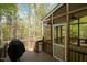 Exterior view of wooden deck featuring a grill with an attached screened in porch at 22 Lure Ct, Durham, NC 27713
