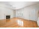 Bright living room boasts hardwood floors, a fireplace and multiple windows for great natural light at 22 Lure Ct, Durham, NC 27713