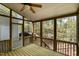 Enjoy the outdoors on this screened porch with wood flooring and natural wooded views at 22 Lure Ct, Durham, NC 27713