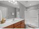 Full bathroom featuring a walk-in shower, vanity with sink, and neutral decor at 232 Vinewood Pl, Holly Springs, NC 27540
