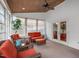 Cozy sunroom with wicker seating and a small loveseat, ideal for relaxing or entertaining guests at 232 Vinewood Pl, Holly Springs, NC 27540