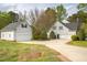 Spacious backyard featuring a detached garage and a well-maintained lawn at 2404 Gillingham Dr, Apex, NC 27539