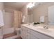 Bathroom featuring double vanity and shower with curtain at 2404 Gillingham Dr, Apex, NC 27539