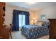 Bedroom featuring a patterned bed, window with curtains, and desk at 2404 Gillingham Dr, Apex, NC 27539