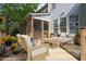 Charming deck area featuring cozy seating, a wooden table, and vibrant floral accents, perfect for outdoor relaxation at 2404 Gillingham Dr, Apex, NC 27539