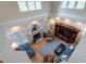 Overhead view of large living room with fireplace, blue sofas and entertainment center at 2404 Gillingham Dr, Apex, NC 27539