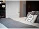 Bedroom details include decorative pillow, hardwood floors, and ample natural light at 2404 Gillingham Dr, Apex, NC 27539