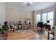 Bright home office with hardwood floors, a desk, and views of the front yard at 2404 Gillingham Dr, Apex, NC 27539