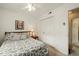 Comfortable bedroom with patterned bedding, a closet, and neutral decor at 2415 Alpine Rd, Durham, NC 27707