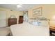Bright bedroom featuring a floral headboard, yellow walls, and classic decor at 2415 Alpine Rd, Durham, NC 27707