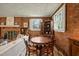Charming dining area features a round wooden table and chairs with brick accent wall at 2415 Alpine Rd, Durham, NC 27707