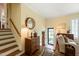 Bright foyer showcasing hardwood floors, staircase, and decorative furnishings at 2415 Alpine Rd, Durham, NC 27707
