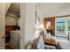 Convenient laundry area with modern appliances, adjacent to a cozy seating space at 2415 Alpine Rd, Durham, NC 27707