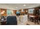 Spacious living room with brick walls, comfortable seating, and a view to the outside at 2415 Alpine Rd, Durham, NC 27707