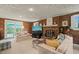 Spacious living room with a cozy fireplace, plush seating, and ample natural light at 2415 Alpine Rd, Durham, NC 27707