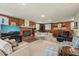 Bright living room featuring a fireplace, large windows, and comfortable seating arrangements at 2415 Alpine Rd, Durham, NC 27707