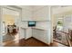 Corner office space with white cabinets, subway tile backsplash and hardwood floors at 2415 Alpine Rd, Durham, NC 27707