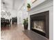 View showcases dining area with modern lighting and glimpses of fireplace and kitchen at 2651 Mellow Field Dr # 206, Raleigh, NC 27604