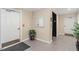 Well-lit entryway with neutral walls, tiled flooring, and a decorative mirror at 2651 Mellow Field Dr # 206, Raleigh, NC 27604