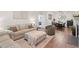 Open-concept living area shows sofa, fireplace, and dining space, bathed in natural light at 2651 Mellow Field Dr # 206, Raleigh, NC 27604