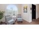 Cozy lobby area with seating, a large window, and an elevator at 2651 Mellow Field Dr # 206, Raleigh, NC 27604