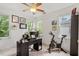 Inviting home office featuring three large windows and space for an exercise bike at 2651 Mellow Field Dr # 206, Raleigh, NC 27604