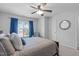 Bedroom featuring neutral tones, comfortable bed, and plenty of natural light at 2705 Evanston Ave, Durham, NC 27703