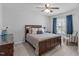 Comfortable bedroom with a plush bed, soft carpeting, and natural light at 2705 Evanston Ave, Durham, NC 27703