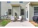 Cozy patio setup with seating, perfect for enjoying outdoor meals or relaxing with a book at 2705 Evanston Ave, Durham, NC 27703