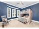 Bedroom with a bunk bed, reading chair, and a bay window with plantation shutters at 2832 Thompson Bluff Dr, Cary, NC 27519