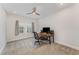 Functional bedroom with a desk setup, neutral walls, and a ceiling fan at 2832 Thompson Bluff Dr, Cary, NC 27519