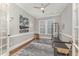 Bright exercise room featuring hardwood floors, a ceiling fan, natural light, and a pilates reformer at 2832 Thompson Bluff Dr, Cary, NC 27519