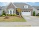 Charming brick home with well-maintained landscaping and a two-car garage in a beautiful neighborhood at 2832 Thompson Bluff Dr, Cary, NC 27519