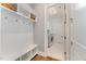 Mudroom featuring a built-in bench with storage cubbies and access to the laundry room at 2832 Thompson Bluff Dr, Cary, NC 27519