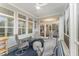 Relaxing screened porch featuring comfortable seating and plenty of natural light at 2832 Thompson Bluff Dr, Cary, NC 27519