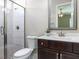 Bathroom featuring marble-tiled walk-in shower and wooden vanity at 2905 Pluton Pl, Rolesville, NC 27571