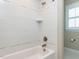 Bright bathroom featuring a tub and white tile with a tiled niche at 2905 Pluton Pl, Rolesville, NC 27571