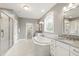 This bathroom features a stand up shower, soaking tub, and double vanity at 2905 Pluton Pl, Rolesville, NC 27571