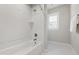Bright bathroom featuring a tub and shower combination with subway tile surround at 2905 Pluton Pl, Rolesville, NC 27571