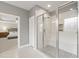 This bathroom features a glass shower with seat and doorway leading to the bedroom at 2905 Pluton Pl, Rolesville, NC 27571