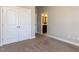 A bedroom features carpeted floors and a closet door leading to an en-suite bathroom at 2905 Pluton Pl, Rolesville, NC 27571