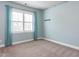 Light blue bedroom with a large window dressed with matching light blue curtains at 2905 Pluton Pl, Rolesville, NC 27571