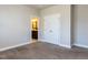 Light neutral bedroom with ensuite bathroom with closet featuring double doors at 2905 Pluton Pl, Rolesville, NC 27571