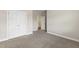This carpeted bedroom features neutral walls and a double closet door at 2905 Pluton Pl, Rolesville, NC 27571