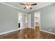 Bedroom with hardwood floors leading to closets and bathroom at 2905 Pluton Pl, Rolesville, NC 27571