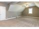 Large bonus room with neutral walls, ceiling fan, dormer, and a bright window at 2905 Pluton Pl, Rolesville, NC 27571